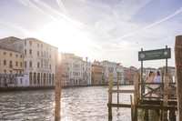 Couple embracing by Venice waterfront