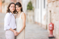 Portrait of couple standing side by side during engagement in Venice