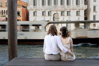 Couple seated by Venice waterfront