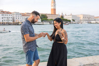 Couple smiling after proposal in Venice at Punta della Dogana.