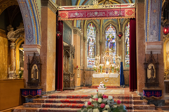 Priests conducting christening service Armenian Church
