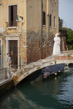 Venetian canal with Ponte Chiodo bridge and historic buildings.