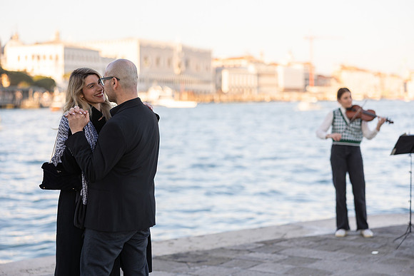 Couple walking near Punta della Dogana