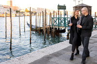 Couple walking by the water in Venice