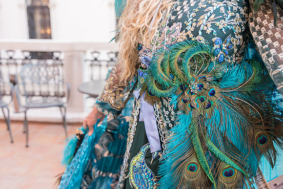 Couple in elaborate blue and gold custom-made carnival attire in Venice