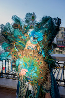Couple posing by the Grand Canal in elaborate self-made costumes