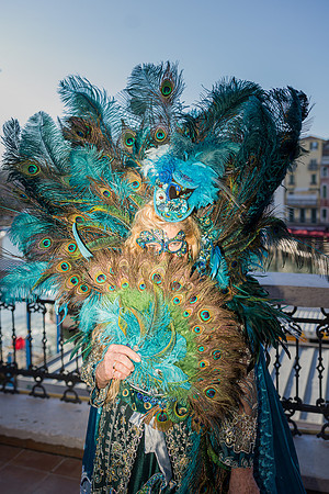 Couple posing by the Grand Canal in elaborate self-made costumes