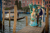 Full body shot of a couple in stunning self-made Venetian carnival attire