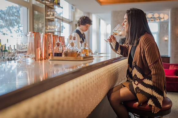 Woman with evening cocktail at St. Regis Venice