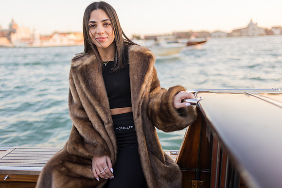 Portrait of a woman on a water taxi near St. George Island, Venice