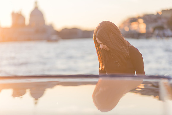 Golden hour portrait on a water taxi in Venice