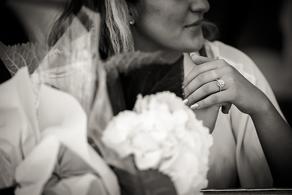 Engaged couple hugging after proposal at Café Florian