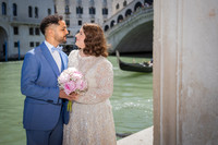 Couple standing near the canal in Venice
