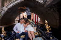 Couple sharing a romantic moment on a gondola ride in Venice