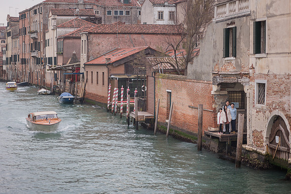 Venetian canal in winter with historic buildings and calm waters.