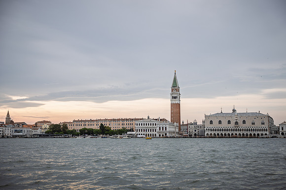 Panoramic view of Venice lagoon and St. Mark's Square during sunset.