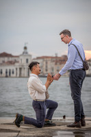Man asking his partner to marry him at sunset in Venice.