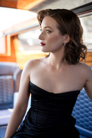 Profile portrait of Sunny Mittmann looking out the window of a water taxi.