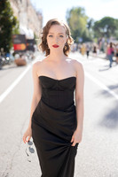 Sunny Mittmann walking confidently down a street at the Venice Film Festival.