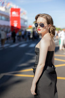 Sunny Mittmann wearing sunglasses and looking over her shoulder outside.