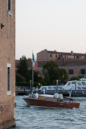 A boat arriving at the dock of San Giorgio Island