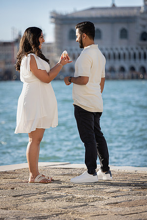 A couple's love story unfolds in a surprise proposal near San Giorgio Maggiore.