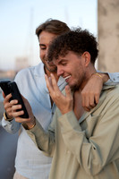 A close up of a couple during their sunset proposal