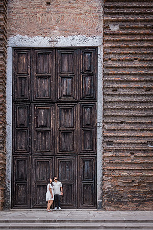 A picture-perfect engagement moment set against a stunning Venetian sunset.