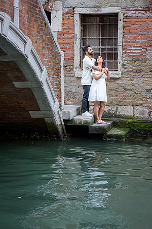 The excitement and emotion of a surprise proposal on the Venetian waterfront.