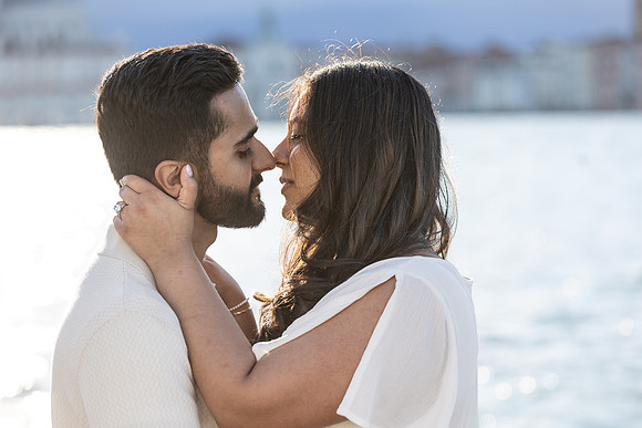 A romantic gondola proposal framed by the stunning Venice backdrop.