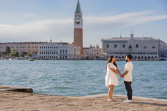 An emotional surprise engagement set against the stunning Venice skyline.