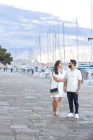 An engagement ring sparkles under the golden light of a Venetian sunset.