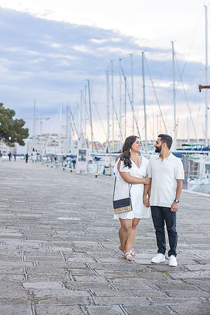 An engagement ring sparkles under the golden light of a Venetian sunset.