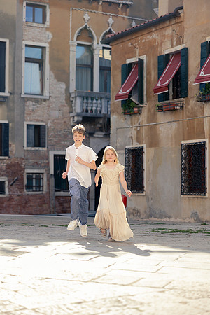 Mother and daughter enjoying Venice sunlight