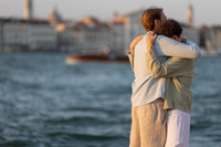 A couple sharing a moment at a cafe in Venice
