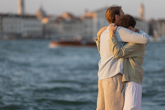 A couple sharing a moment at a cafe in Venice