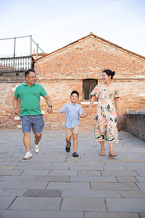 Family exploring Venice on a sunny day