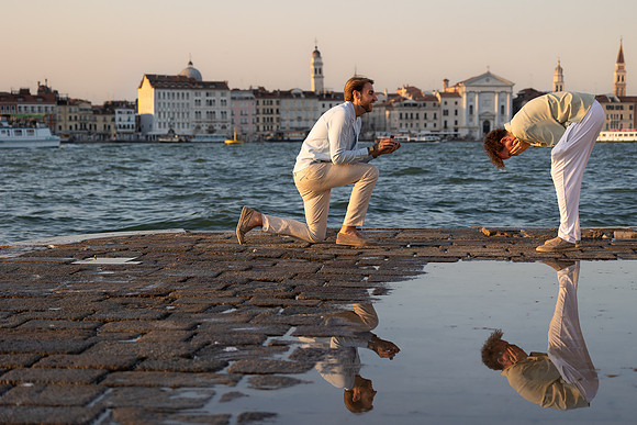 A couple looking at the Grand Canal at sunset