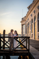 Couple laughing by historic building