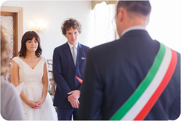 Bride and groom facing the officiant during their civil wedding.