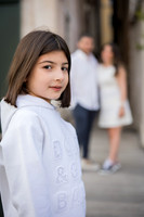 Daughter standing by a canal during a family vacation in Venice