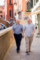 Grandfather and grandson walking in Venice