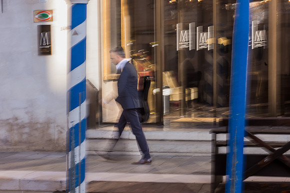 Jacob Reuben walking near the water in Venice