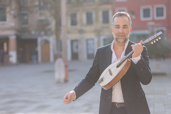 Close up portrait of a mandolin player