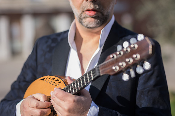 Close up shot of a musician and his instrument