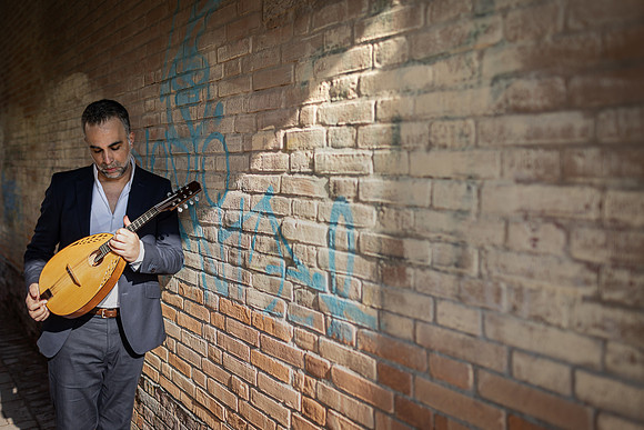 Close up of an acoustic mandolin being held