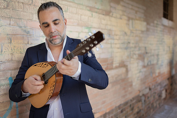 Close up of a musician focusing on his instrument