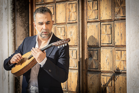 Close up of a man with a mandolin
