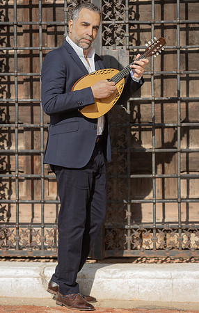 Musician posing with a mandolin in Venice
