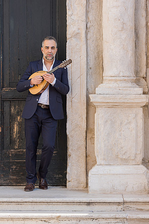 Portrait of Jacob Reuben holding a mandolin